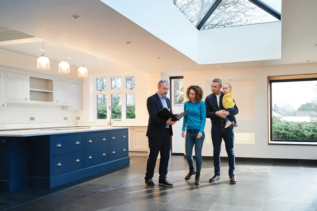 family talking to a real estate agent