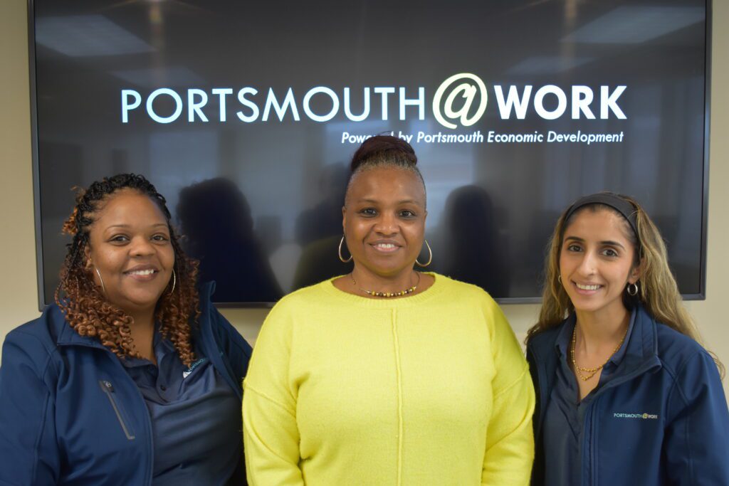 Office photo of three workforce development employees